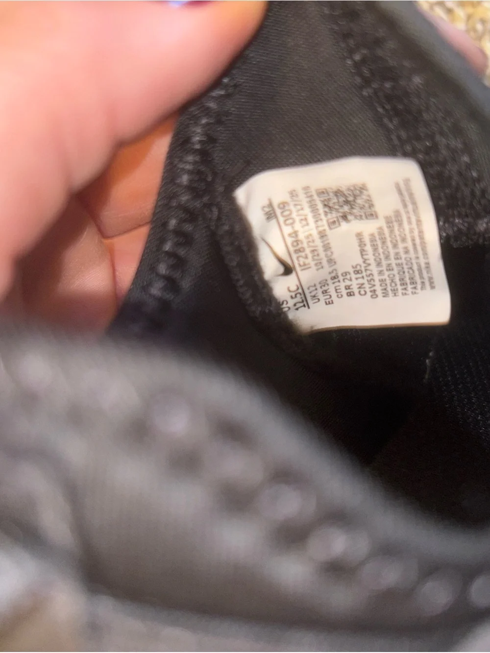 Nike Kids Black Slip-On Sneakers with Gold Logo Strap